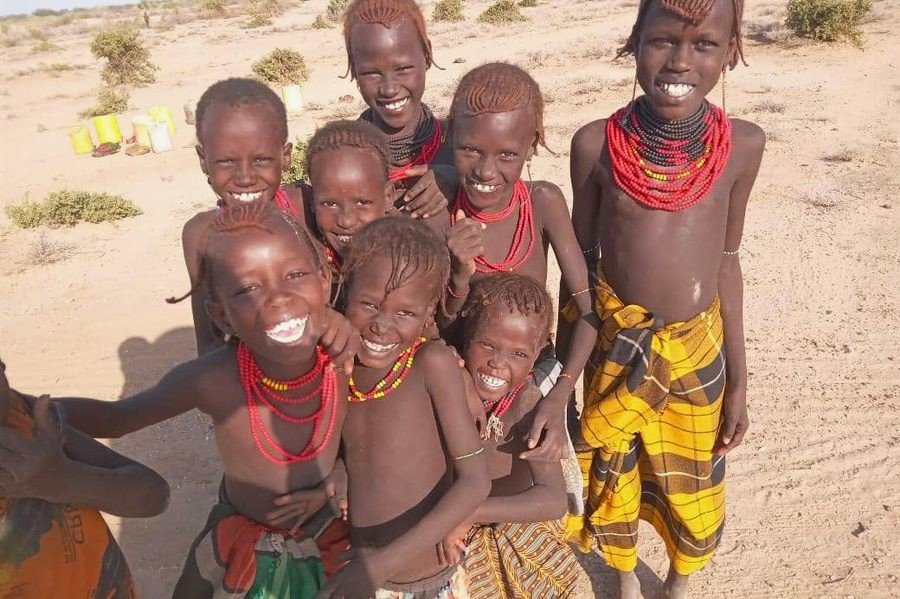 Children laughing together on the dry plain